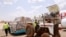 FILE - Airport staff unload cargo sent by Chinese billionaire Jack Ma and his Alibaba Group after it arrives at Juba International Airport, in Juba, South Sudan, March 24, 2020. African health officials say no supplies have reached Eritrea.