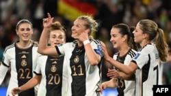 Germany's forward #11 Alexandra Popp (C) celebrates with teammates after scoring her team's second goal during the Australia and New Zealand 2023 Women's World Cup Group H football match between Germany and Morocco at Melbourne Rectangular Stadium, in Melbourne, July 24, 2023. 