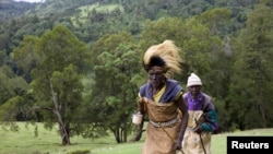 FILE - Kenyan men from the Sengwer community protest over their eviction from their ancestral lands, Embobut Forest, by the government for forest conservation in western Kenya, Apr. 19, 2016. 