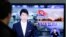 A South Korean man watches a TV news reporting missile launch conducted by North Korea, in Seoul, South Korea, Saturday, May 18, 2013. 