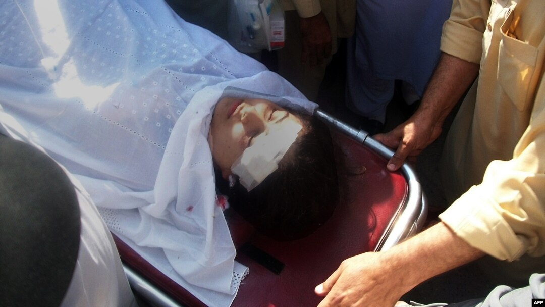 Pakistani hospital workers carry injured Malala Yousafzai, 14, on a stretcher at a hospital following an attack by gunmen in Mingora on October 9, 2012.