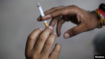 cigarette in hand pic indian WHO to India: Stick to Larger Health Warnings on Cigarette Packs