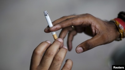 passing a cigarette Stronger Tobacco-control Measures Vital, WHO Warns