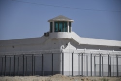 This file photo taken on May 31, 2019, shows a watchtower on a high-security facility near what is believed to be a re-education camp where mostly Muslim ethnic minorities are detained, on the outskirts of Hotan, China.