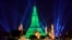 The stupa of the Buddhist temple Wat Arun (Temple of Dawn) is illuminated in green to mark St. Patrick's Day in Bangkok.