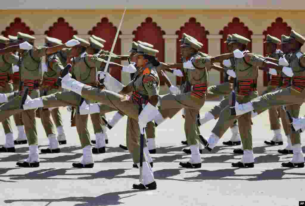 A female Indian Border Security Force (BSF) officer, center, leads a squad of her male and few female colleagues during their passing out ceremony in Bangalore. BSF with a total strength of about 250,000 personnel including women is one of the world’s lar