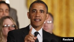 U.S. President Barack Obama delivers a statement on the U.S. "Fiscal Cliff" in the East Room of the White House, November 9, 2012. 