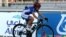 FILE - Israeli cyclist Paz Bash, wearing a conventional hard foam helmet, competes during the Women Elite Road Race at the UCI Road World Championships, in Doha, Qatar, Oct. 15, 2016. Tests have shown that new inflatable helmets offer more protection. 