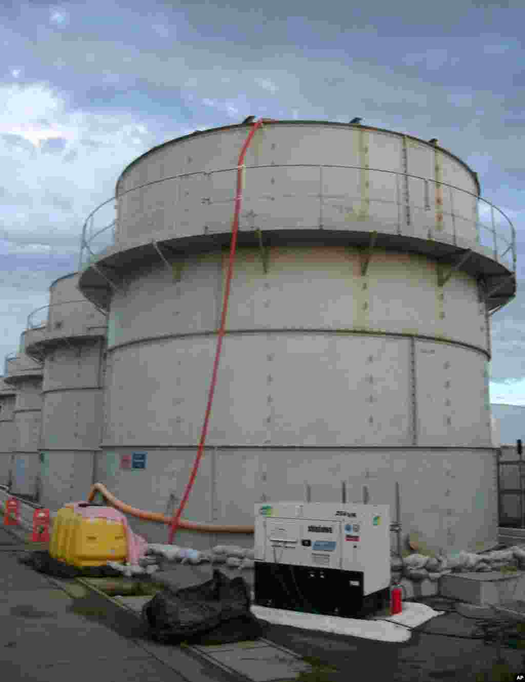 This photo released by Tokyo Electric Power Co. shows the storage tank that workers determined was overfilled, causing a leak of toxic water, Fukushima, Japan, Oct. 3, 2013. 