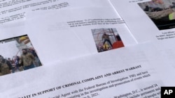 The affidavit from the FBI in support of an arrest warrant for Scott Kevin Fairlamb is photographed on Aug. 6, 2021. The New Jersey gym owner has pleaded guilty of assaulting a law enforcement officer during the Jan. 6 riot at the U.S. Capitol.