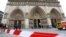 French policemen cordon off in front of Paris' Notre Dame Cathedral following the evacuation of the after a man shot himself dead in front of the altar, May 22, 2013.