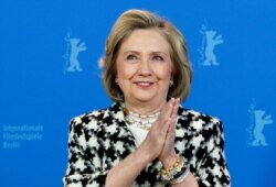 Hillary Clinton gestures as she attends a photo call to promote the movie "Hillary" during the 70th Berlinale International Film Festival in Berlin, Germany, Feb. 25, 2020.