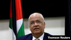 FILE - Chief Palestinian negotiator Saeb Erekat looks on during a news conference following his meeting with foreign diplomats in Ramallah, in the Israeli-occupied West Bank.