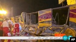 This image taken from a video released by Iranian state television shows the aftermath of a bus crash near Taft, Iran, Aug. 21, 2024. A bus carrying Shiite pilgrims from Pakistan to Iraq crashed in central Iran, killing multiple people, an official said Wednesday. 