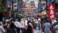 A street is crowded by shoppers in Tokyo on June 24, 2020. Japan’s economy is opening cautiously, with social-distancing restrictions amid the coronavirus pandemic.