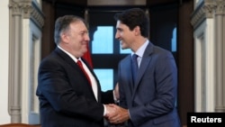 Canada's Prime Minister Justin Trudeau meets with U.S. Secretary of State Mike Pompeo in Trudeau's office on Parliament Hill in Ottawa, Ontario, Aug. 22, 2019.