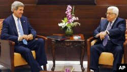 U.S. Secretary of State John Kerry meets with Palestinian President Mahmoud Abbas on July 19, 2013 in the West Bank city of Ramallah. 