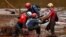 Members of a rescue team search for victims of a collapsed tailings dam owned by Brazilian mining company Vale SA in a vehicle on Paraopeba River, in Brumadinho, Brazil, Feb. 5, 2019. 