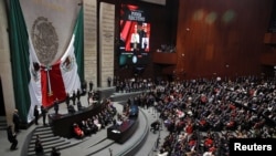 Mexico's President Claudia Sheinbaum speaks during her swearing-in ceremony at the Congress, in Mexico City, Mexico, Oct. 1, 2024. King Felipe VI of Spain was not invited to the event due, in part, to a dispute over Spain's 16th century defeat of Mexico's powerful Aztec rulers.