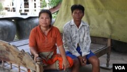 Keo Eat, 52, a deputy Prey Khla commune chief, decided to join the ruling Cambodian People’s Party after being served with a court summons shortly before the deadline to defect. He had been accused of incitement and faced the possibility of going to jail for two years if found guilty. He's shown with his wife, Keo Sarin. (Sun Narin/VOA Khmer)