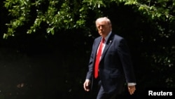 U.S. President Donald Trump departs the White House in Washington