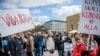 Demonstrators hold placards during the "March for Science Stockholm" manifestation at Medborgarplatsen square in Stockholm, Sweden April 22, 2107.