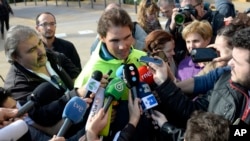 FILE - Spanish tennis player Rafael Nadal talks with reporters in front of a hospital after successfully undergoing an operation to remove his appendix in Barcelona, Spain, Nov. 5, 2014. Nadal had tried to treat his appendix with antibiotics before opting for an appendectomy. A new study from Finland, however, finds antibiotics offer a reasonable alternative to surgery for many such patients.