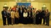 U.S. Secretary of State John Kerry poses for a photograph with staff members of the U.S. Embassy in Cairo, Egypt, on November 3, 2013.