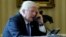 FILE - President Donald Trump conducts a phone call in the Oval Office at the White House in Washington, Jan. 28, 2017.