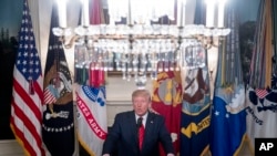 President Donald Trump speaks in the Diplomatic Room of the White House in Washington, Sunday, Oct. 27, 2019, to announce that Islamic State leader Abu Bakr al-Baghdadi has been killed during a US raid in Syria.