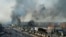 Smoke rises after Egyptian protesters clash with police, unseen, in Port Said, Egypt, January 27, 2013. 