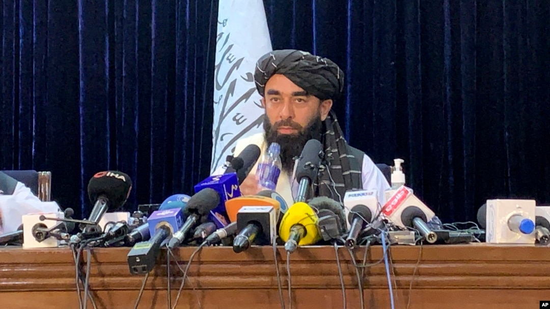 aliban spokesman Zabihullah Mujahid speaks at at his first news conference in Kabul, Afghanistan, Tuesday, Aug. 17, 2021. For years, Mujahid had been a shadowy figure issuing statements on behalf of the militants. 