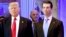US President-elect Donald Trump along with his son Donald, Jr., arrive for a press conference at Trump Tower in New York, as Allen Weisselberg, chief financial officer of The Trump, looks on.