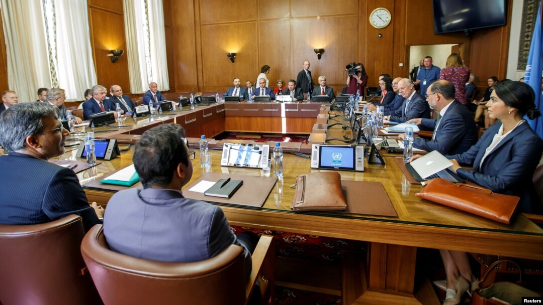 FILE - Iran's Deputy Foreign Minister Hossein Jaberi Ansari, Russian envoy Alexander Lavrentiev, Turkish Deputy Foreign Minister Sedat Onal and U.N. envoy Staffan de Mistura attend a meeting on Syria at European U.N. headquarters in Geneva, Sept. 11, 2018.