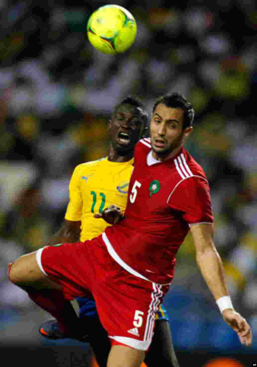Morocco's Amine fights for the ball with Gabon's Charly during their African Cup of Nations soccer match in Libreville