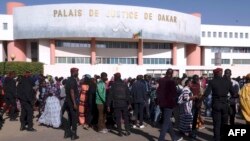 FILE - People queue to enter the Court in Dakar on Dec. 14, 2017, to attend the trial of Dakar's popular mayor Khalifa Sall and four of his associates on charges of embezzling public funds. 