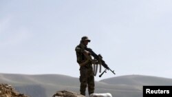 FILE - An Afghan National Army soldier keeps watch during a patrol in Dand Ghori district of Baghlan province, Afghanistan, March 15, 2016. The province was taken over by Taliban in recent weeks, but anti-Taliban forces retook some areas Aug. 20, 2021. 