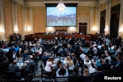 A video from the January 6 Attack on the United States Capitol is shown on a screen during the hearing of the U.S. House Select Committee to Investigate the January 6 Attack on the United States Capitol, on Capitol Hill in Washington, U.S., June 9, 2022. (Jabin Botsford/Pool via REUTERS)