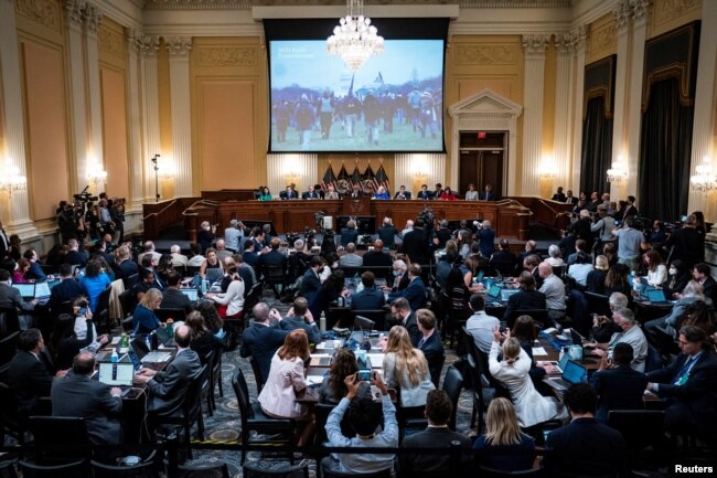 A video from the January 6 Attack on the United States Capitol is shown on a screen during the hearing of the U.S. House Select Committee to Investigate the January 6 Attack on the United States Capitol, on Capitol Hill in Washington, U.S., June 9, 2022. (Jabin Botsford/Pool via REUTERS)