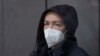 Radio Free Europe-Radio Liberty editor Alsu Kurmasheva stands in a glass cage in a courtroom in Kazan, Russia, Monday, Oct. 23, 2023.