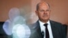 FILE - German Chancellor Olaf Scholz arrives for a Cabinet meeting at the chancellery in Berlin, Sept. 18, 2024. He will hold meetings with his top two ministers to try to find common ground after they put forward contradictory plans to fix the nation's ailing economy.