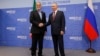 FILE - Russian President Vladimir Putin, right, and Iranian President Masoud Pezeshkian shake hands during their meeting on the sidelines of BRICS summit in Kazan, Russia, Oct. 23, 2024.