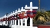 A cross for each of the victims waits to be taken to a growing memorial site two days after a mass shooting at a Walmart store in El Paso, Texas, Aug. 5, 2019. 