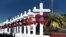 A cross for each of the victims waits to be taken to a growing memorial site two days after a mass shooting at a Walmart store in El Paso, Texas, Aug. 5, 2019. 