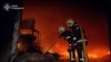 FILE - Firefighters work at the site of a warehouse hit by a Russian drone strike, amid Russia's attack on Ukraine, in Sumy, Ukraine, March 6, 2025. (Press service of the State Emergency Service of Ukraine in Sumy region/Handout via Reuters)