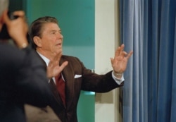 FILE - President Ronald Reagan tells reporters that "I'm not taking any more questions," during a news conference in the White House briefing room, Nov. 25, 1986.