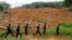 FILE - Sri Lankan army soldiers carry out a search operation in Elangapitiya village in Aranayaka, about 70 kilometers (45 miles) north of Colombo, Sri Lanka, May 19, 2016. Heavy rains pounded the central Sri Lankan region where at least three villages were swallowed by mountains of mud.