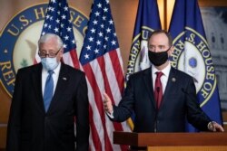 Rep. Adam Schiff, chairman of the House Intelligence Committee, right, speaks accompanied by House Majority Leader Steny Hoyer, during a news conference on Capitol Hill, after a meeting at the White House, in Washington, June 30, 2020.