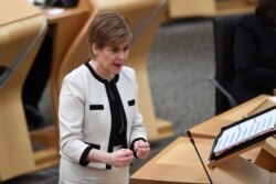 Scotland's First Minister Nicola Sturgeon attends the First Minister's Questions at the Scottish Parliament in Holyrood, Edinburgh, Scotland, Jan. 13, 2021.