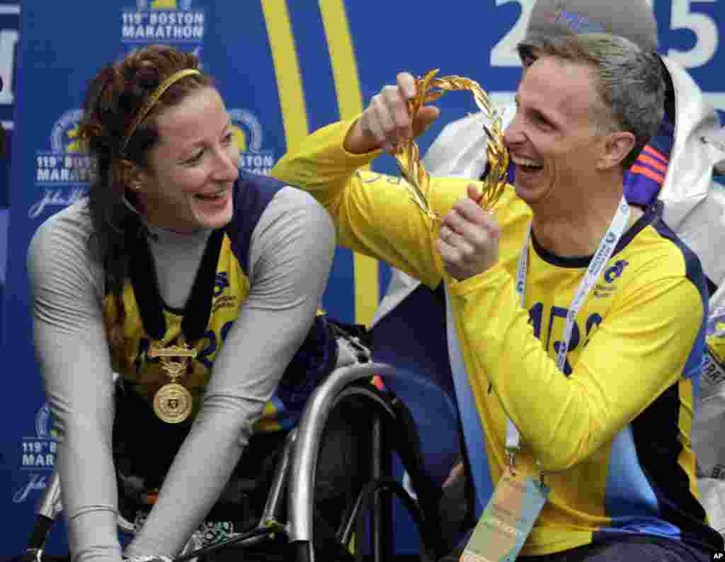 Bill Richard, father of 2013 Boston Marathon bombing victim Martin Richard, prepares to put the victor&#39;s wreath on women&#39;s wheelchair division winner Tatyana McFadden of Russia, at the Boston Marathon, April 20, 2015.